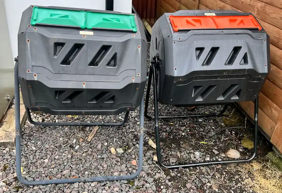 Two off-ground compost tumbler bins