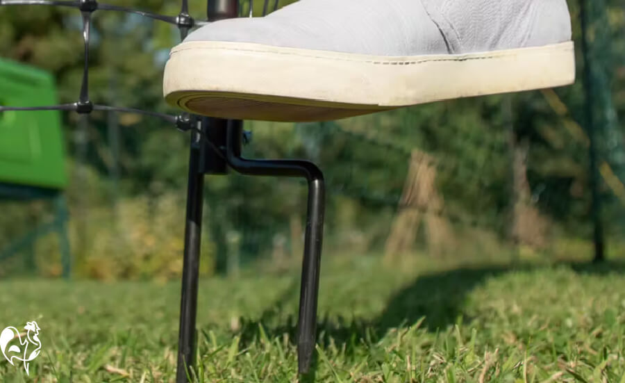 Omlet fencing: the foot of the poles, with a shoe pushing it into the ground.
